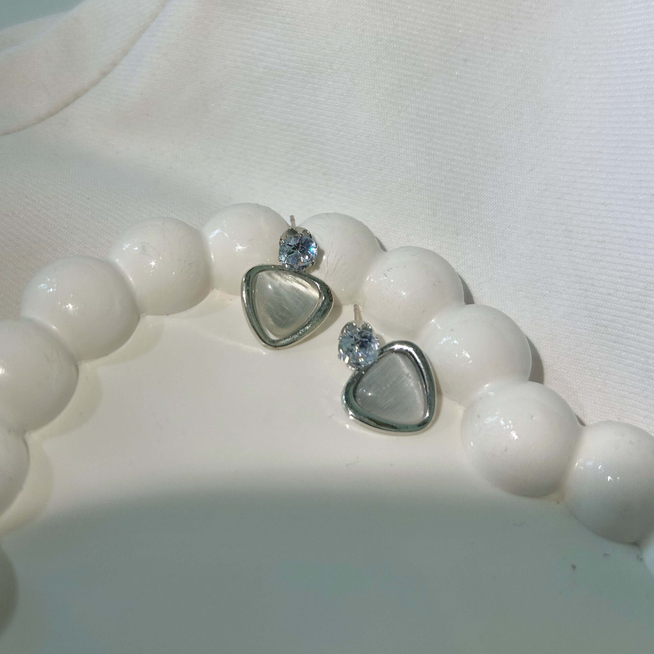 Minimalist White Stone Stud Earrings with Geometric-Cut Crystal - Image 3