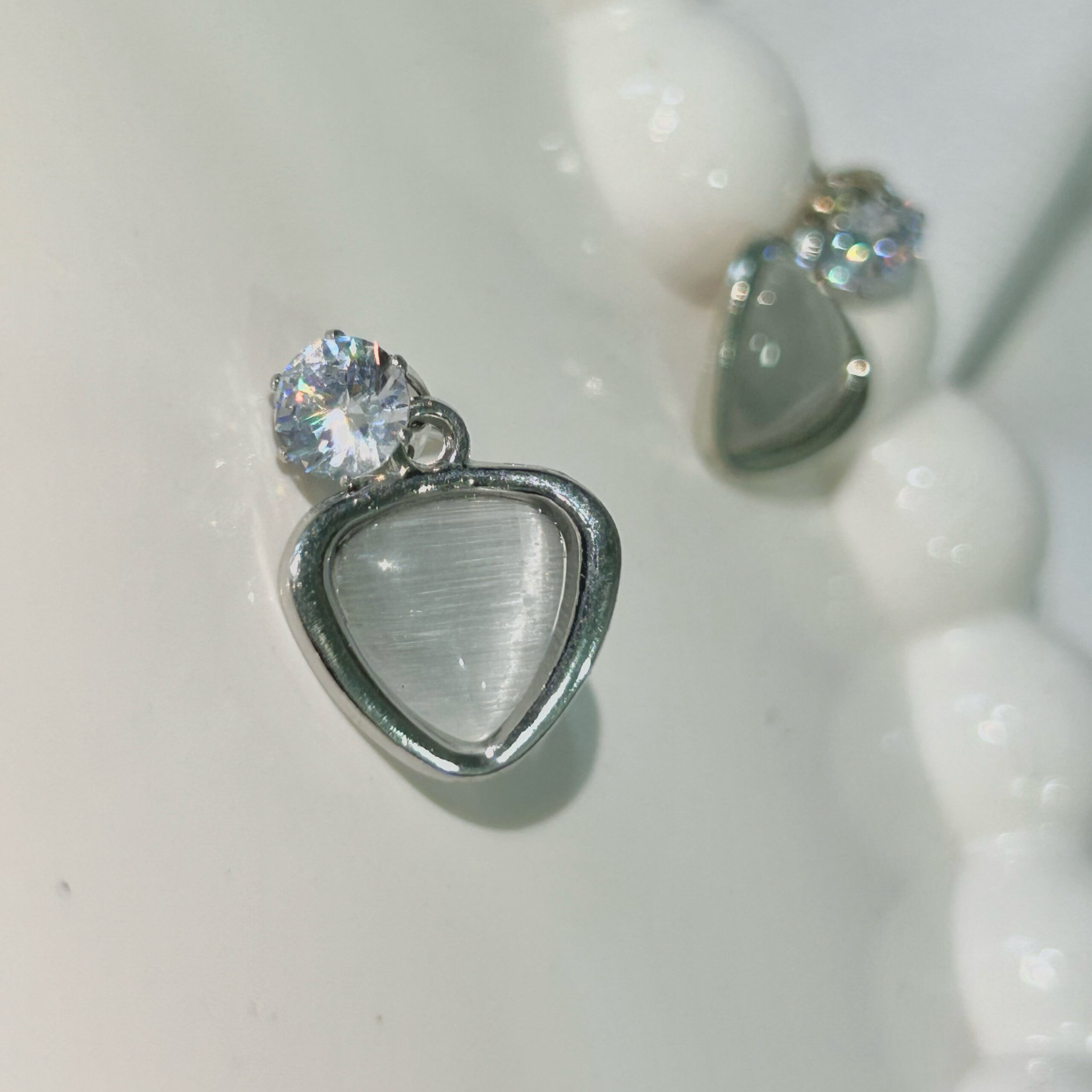 Minimalist White Stone Stud Earrings with Geometric-Cut Crystal - Image 2