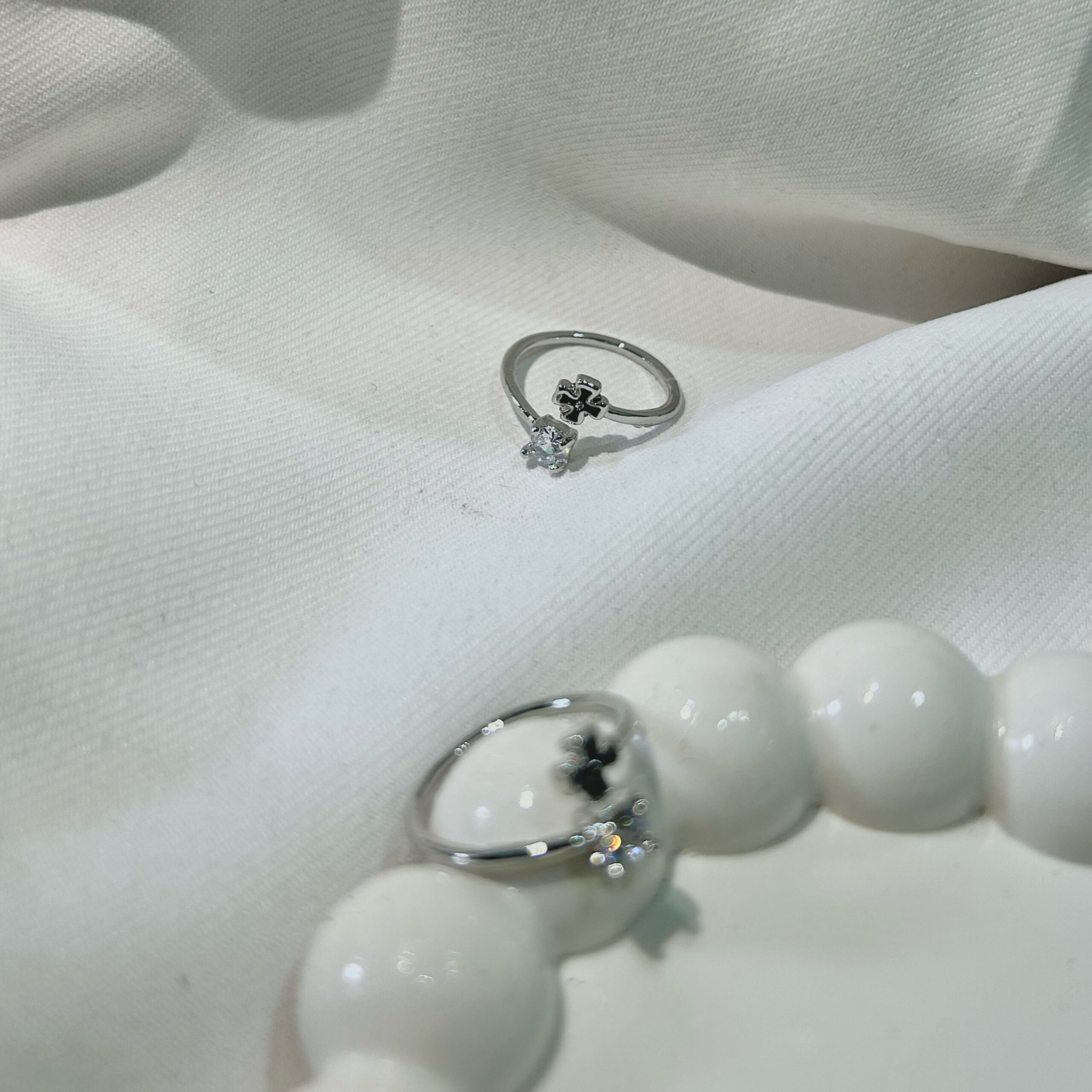 stunning silver-plated floral design and studded shimmering white diamond Adjustable finger ring for women and girls.