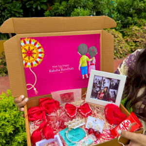 Premium Red Color Rakhi Hampper Of Clature with Frame , Bow , Photo fram total 13 product